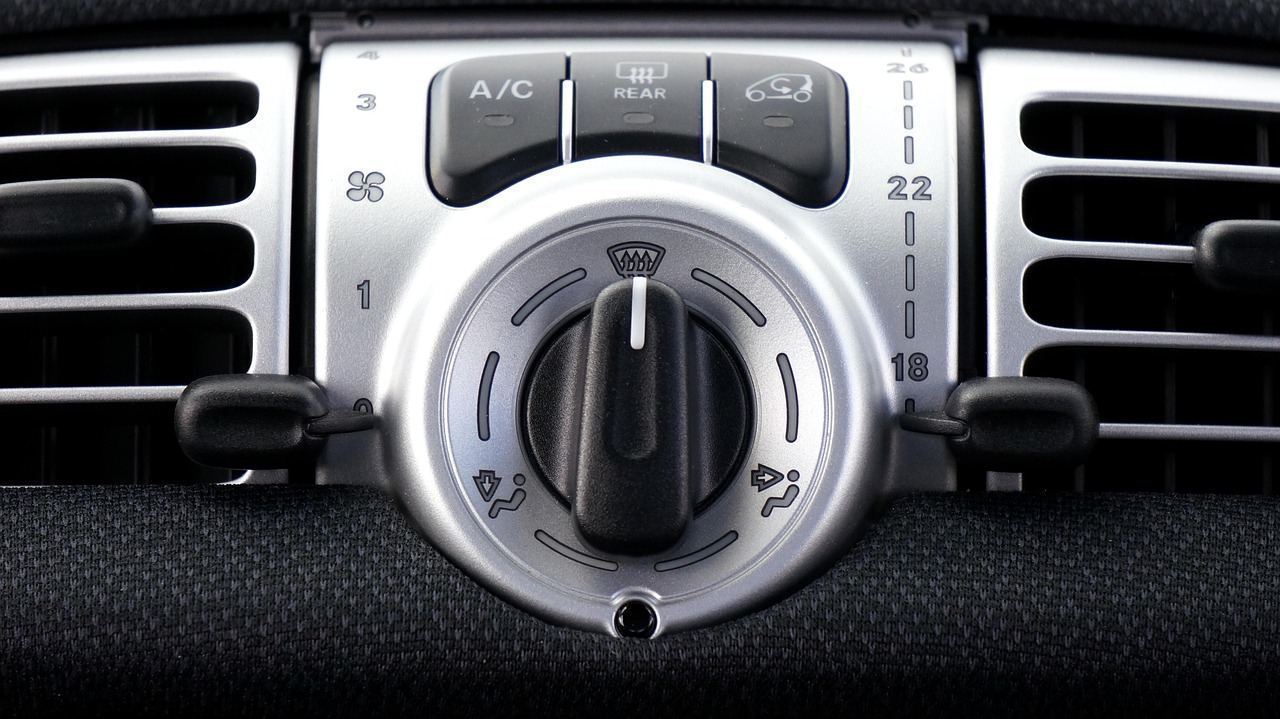 A/C recharge gauges in use after a parking-deck heat call